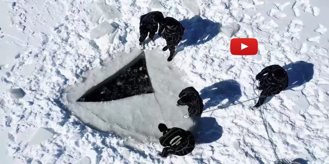 Buzla kaplı gölette nefes kesen dalış